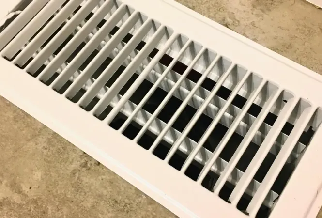 HVAC air vents inspection in West Palm Beach FL home showing AC odor issue Palm Beach County Florida